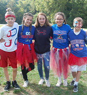 students dressed up in spirit gear with face paint